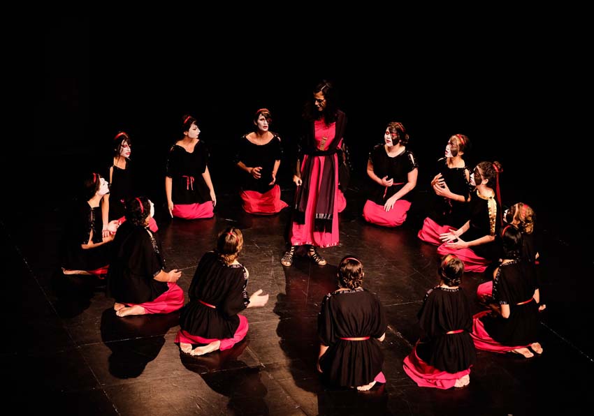 Circle of women listening to one who is standing